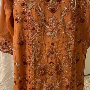 Shaffon salary suit with heavy embroidery work . Fully lining.tailored stitch.